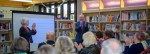 People clapping in the library at the launch celebration.